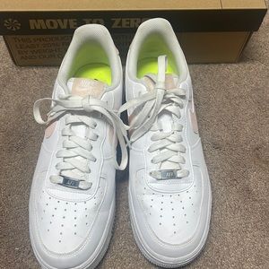 Air Force ones with pink Nike sign